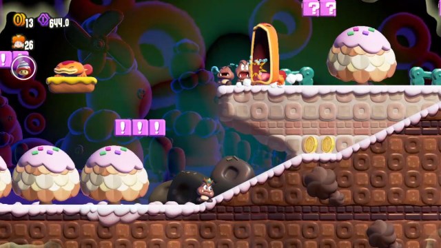 Une capture d’écran de Super Mario Bros. Wonder de Daisy en tant que Goomba, tandis qu’une Gueule d’Antre mange un Goomba endormi sur une plate-forme plus élevée.